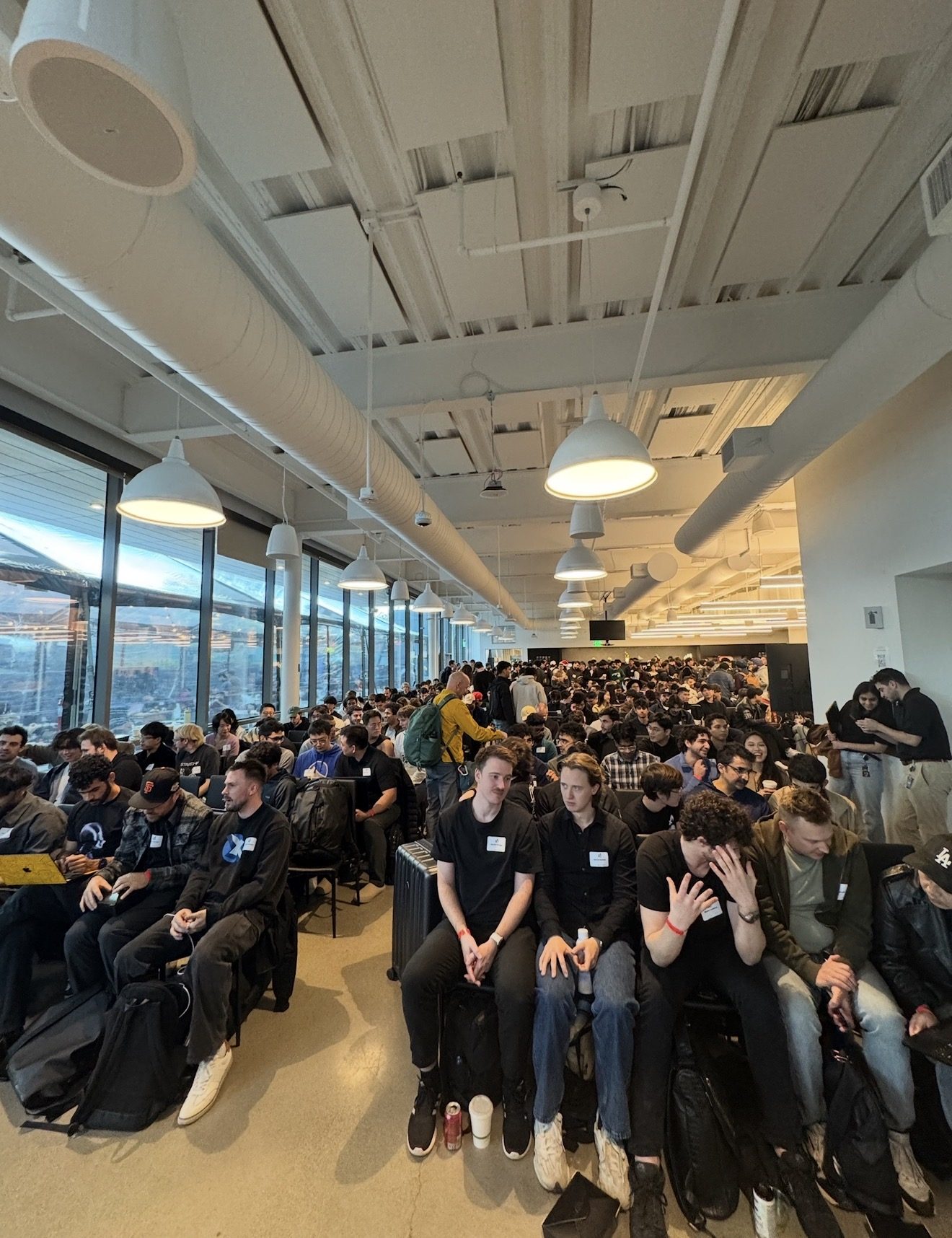 A large hall packed with developers